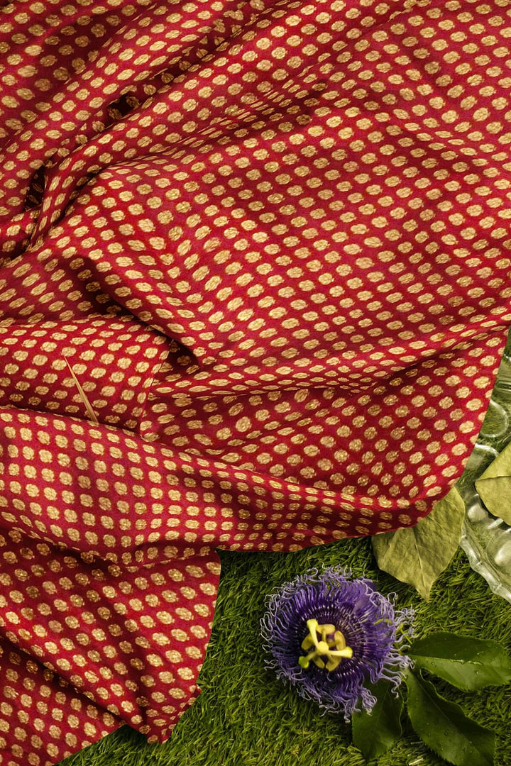 Banarasi  silk fabric in maroon . Available in multiples of 1M & 2.5M