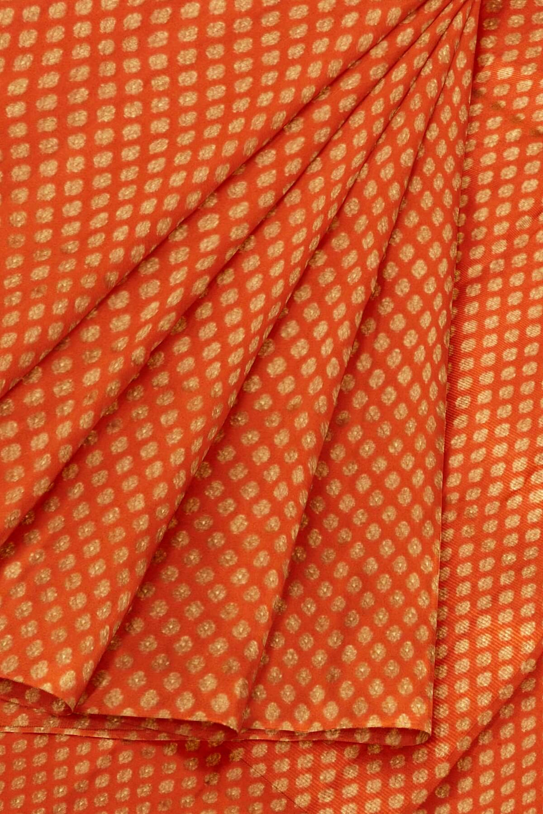 Banarasi  silk fabric in orange. Available in multiples of 1M & 2.5M