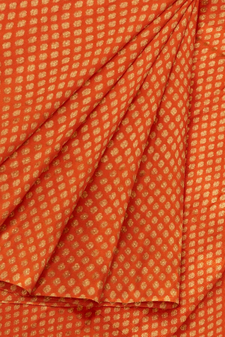 Banarasi  silk fabric in orange. Available in multiples of 1M & 2.5M