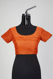Banarasi  silk fabric in orange. Available in multiples of 1M & 2.5M