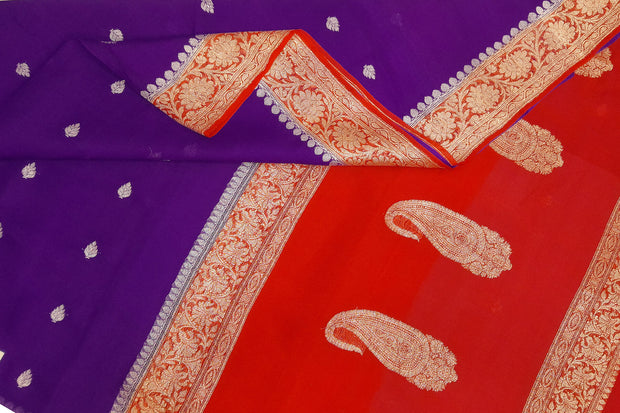 Banarasi silk chiffon  saree in violet  with silver buttis & border and a contrast pallu in red