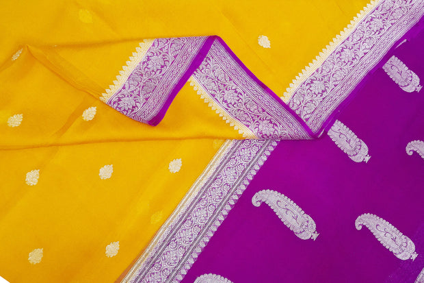 Banarasi silk chiffon  saree in mustard  with silver buttis & border and a contrast pallu in purple