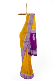 Banarasi silk chiffon  saree in mustard  with silver buttis & border and a contrast pallu in purple