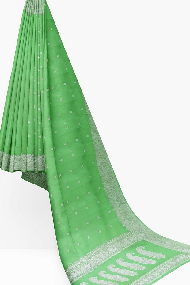 Banarasi silk chiffon  saree in green with silver  buttis &  border