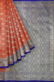 Handloom Banarasi silk saree in satin weave in red with floral motifs all over the body.