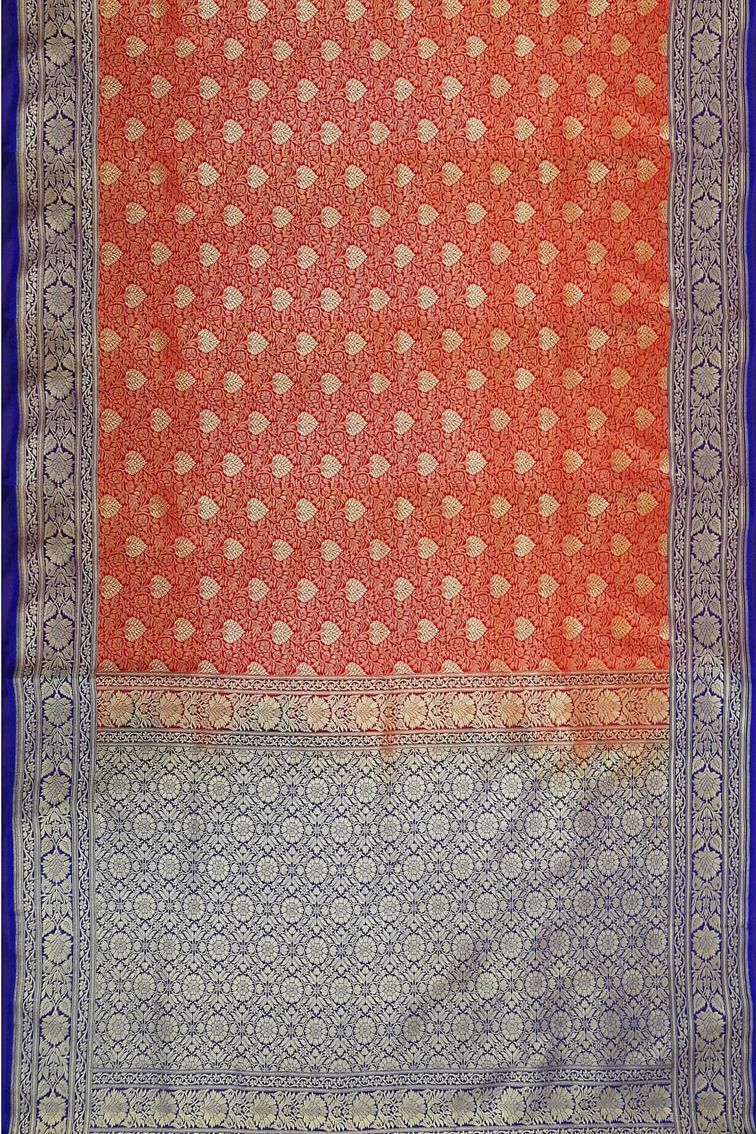 Handloom Banarasi silk saree in satin weave in red with floral motifs all over the body.