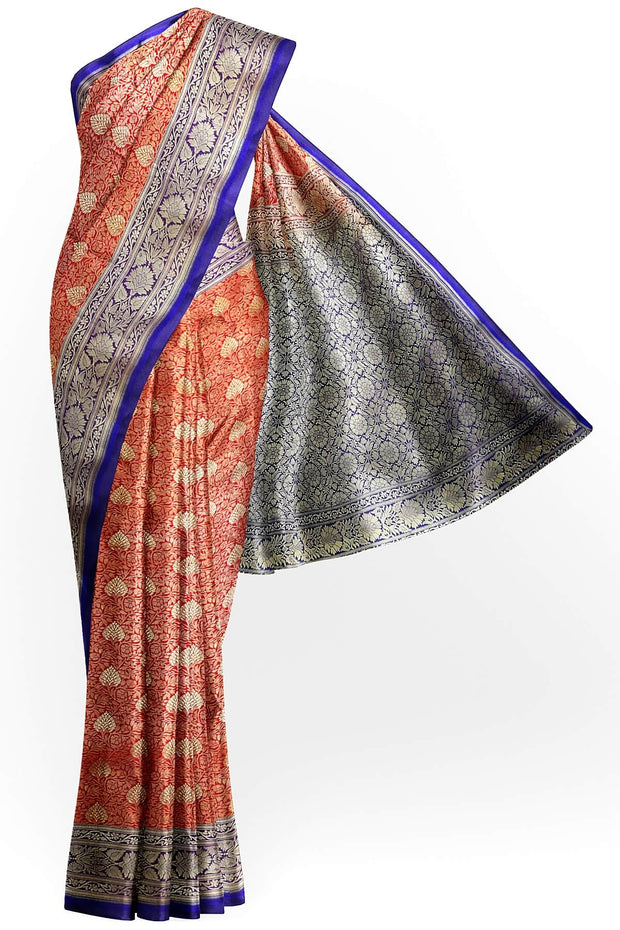 Handloom Banarasi silk saree in satin weave in red with floral motifs all over the body.