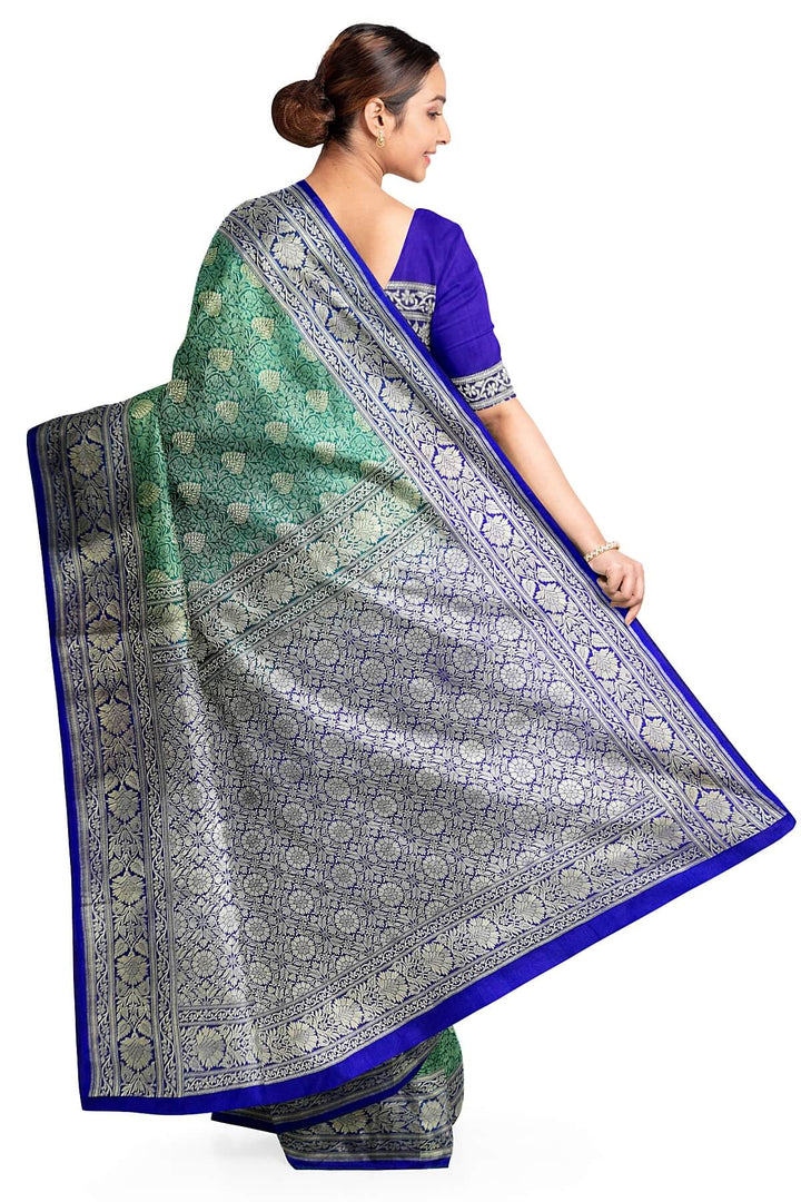 Handloom Banarasi silk saree in satin weave in red with floral motifs all over the body.