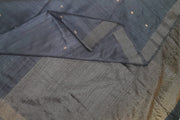 Matka silk saree in black with small  zari  motifs.