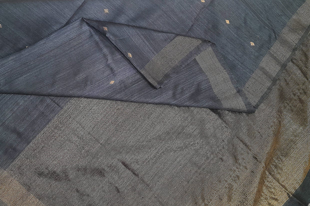 Matka silk saree in black with small  zari  motifs.