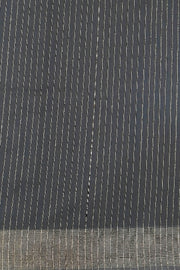 Matka silk saree in black with small  zari  motifs.