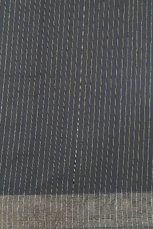 Matka silk saree in black with small  zari  motifs.
