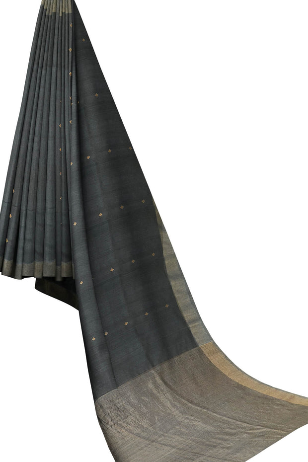 Matka silk saree in black with small  zari  motifs.