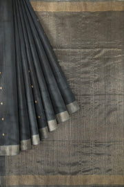 Matka silk saree in black with small  zari  motifs.