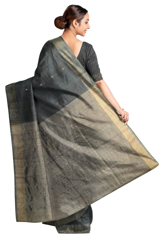 Matka silk saree in black with small  zari  motifs.
