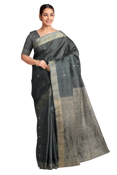 Matka silk saree in black with small  zari  motifs.