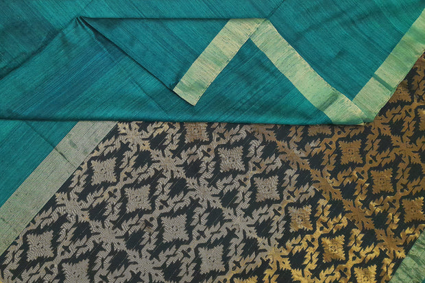 Matka silk saree in teal blue with a  jamdani weave pallu in geometric pattern