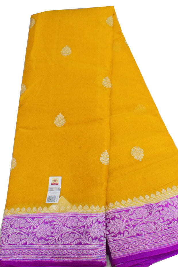 Banarasi silk chiffon  saree in mustard  with silver buttis & border and a contrast pallu in purple