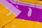 Banarasi silk chiffon  saree in mustard  with silver buttis & border and a contrast pallu in purple