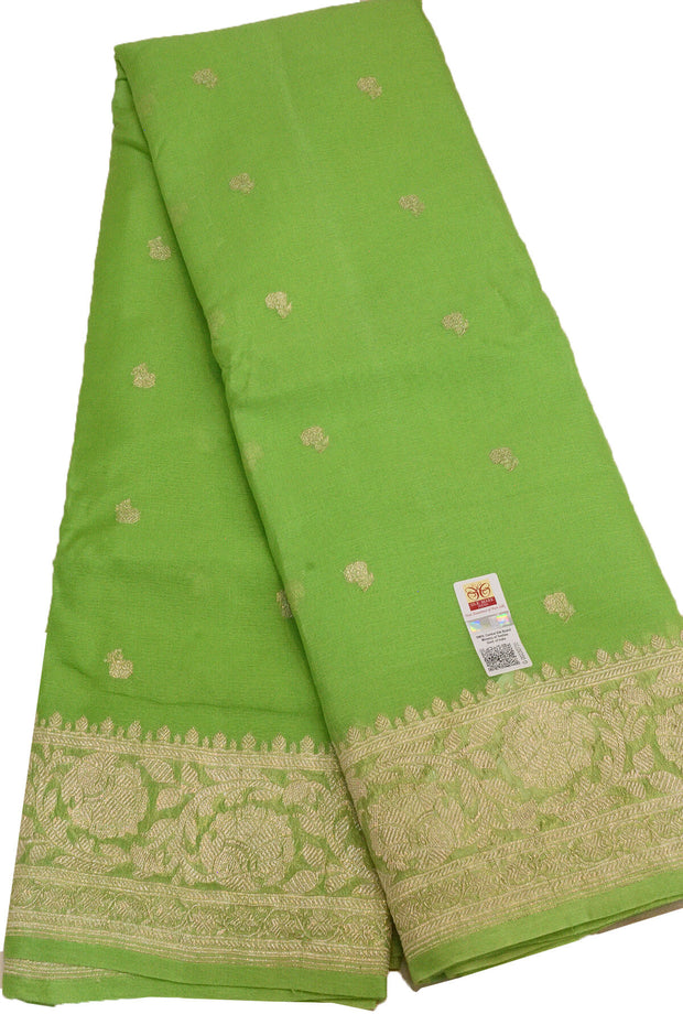 Banarasi silk chiffon  saree in green with silver  buttis &  border