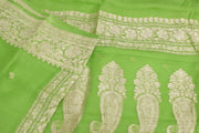 Banarasi silk chiffon  saree in green with silver  buttis &  border