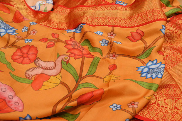 Kanchipuram pure silk printed saree in  two tone coral- orange & peach with birds and paisley floral vines.