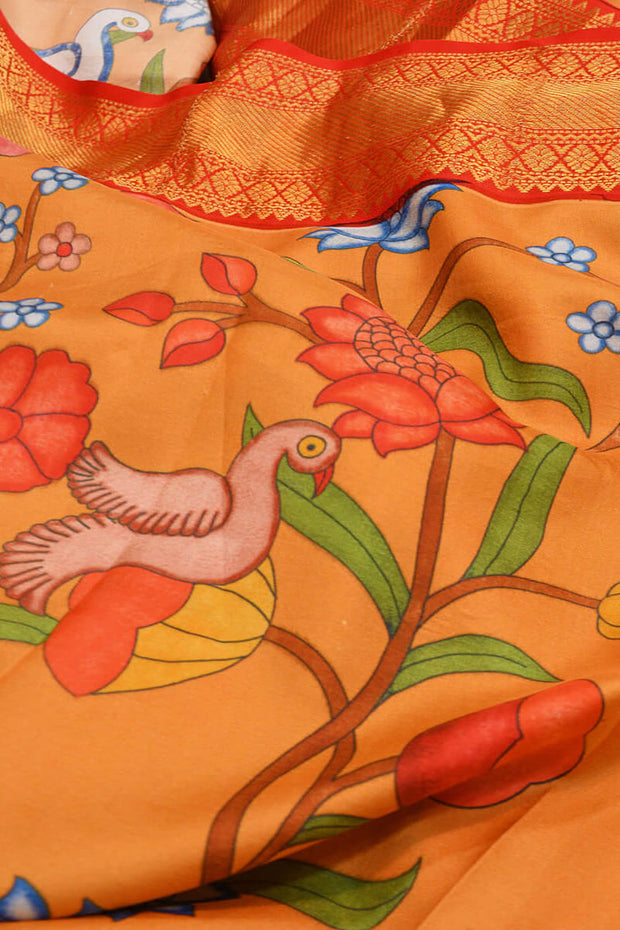 Kanchipuram pure silk printed saree in  two tone coral- orange & peach with birds and paisley floral vines.