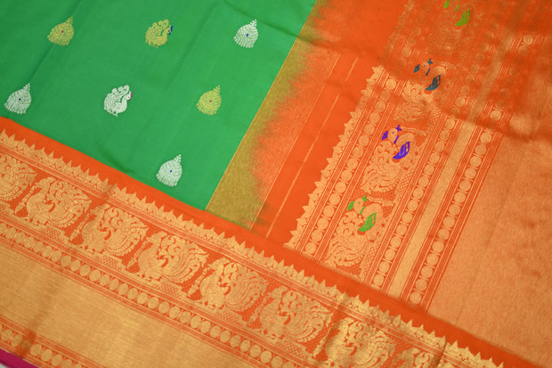 Handwoven Kanchi pure silk pure zari saree in green with gold & silver motifs