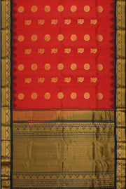 Handwoven Gadwal pure silk saree in red with disc & floral motifs and rich pallu with temple border