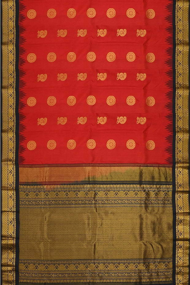 Handwoven Gadwal pure silk saree in red with disc & floral motifs and rich pallu with temple border