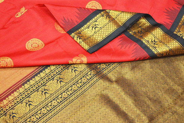 Handwoven Gadwal pure silk saree in red with disc & floral motifs and rich pallu with temple border