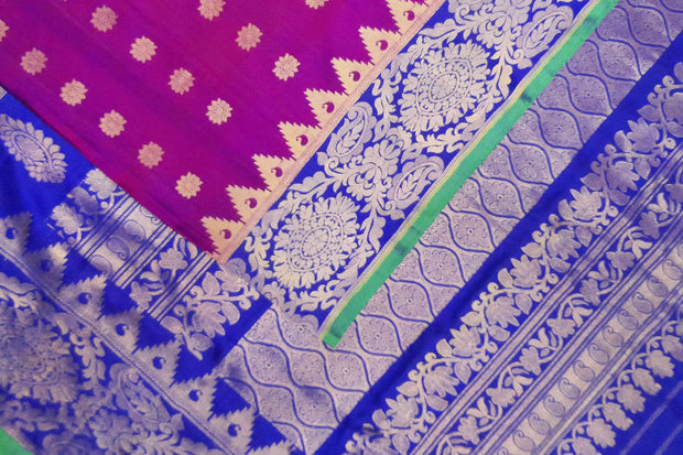 Handwoven Gadwal pure silk saree in purple with floral motifs all over the body.