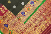 Handwoven Gadwal pure silk saree in black  with gold & silver floral motifs