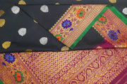 Handwoven Gadwal pure silk saree in black  with gold & silver floral motifs