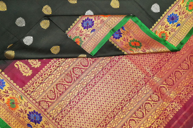 Handwoven Gadwal pure silk saree in black  with gold & silver floral motifs