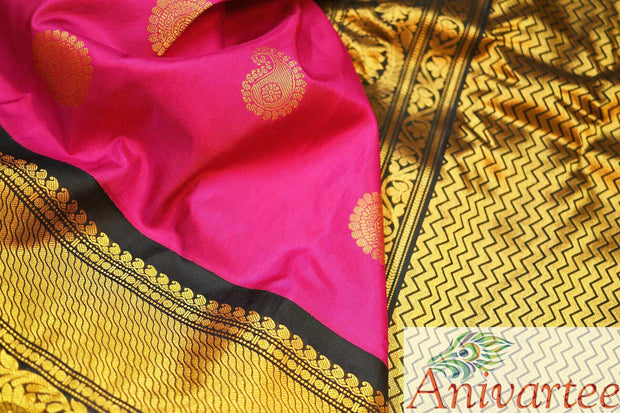 Handwoven Gadwal in pink with gold & silver buttas and a big border.