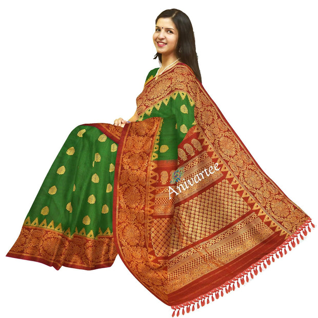 Handwoven Gadwal pure silk saree in bottle green with gold motifs