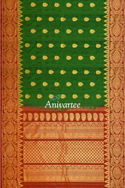 Handwoven Gadwal pure silk saree in bottle green with gold motifs