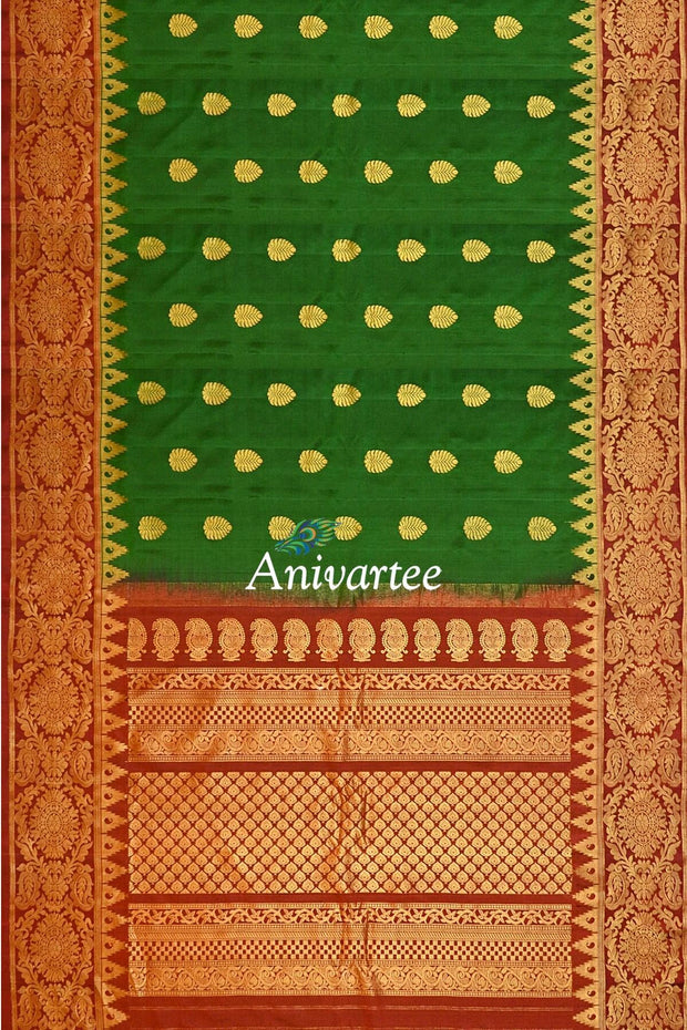 Handwoven Gadwal pure silk saree in bottle green with gold motifs