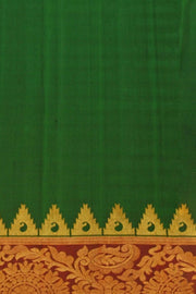 Handwoven Gadwal pure silk saree in bottle green with gold motifs
