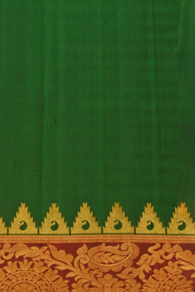 Handwoven Gadwal pure silk saree in bottle green with gold motifs