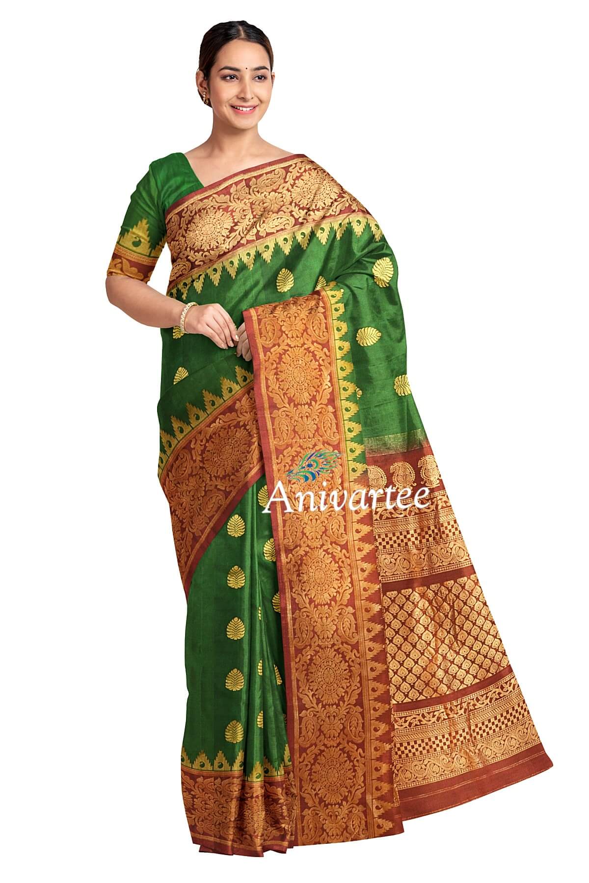 Handwoven Gadwal pure silk saree in bottle green with gold motifs