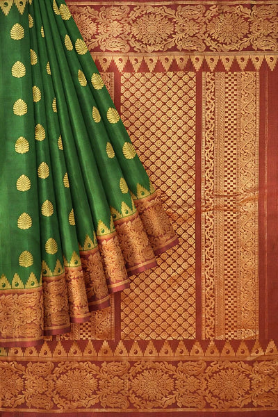 Handwoven Gadwal pure silk saree in bottle green with gold motifs