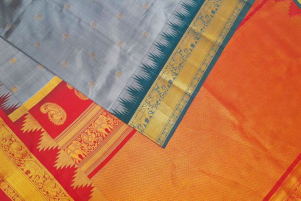 Gadwal pure silk saree in ash grey with small motifs on the body.