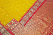 Gadwal pure silk saree in yellow with small motifs on the body