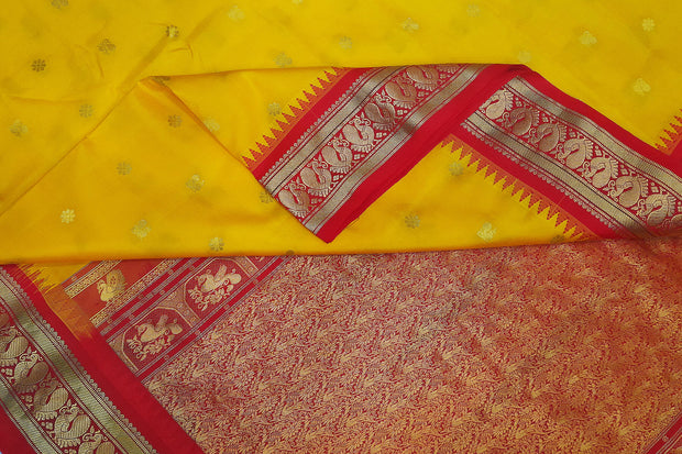 Gadwal pure silk saree in yellow with small motifs on the body