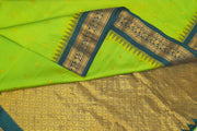 Gadwal pure silk saree in leaf green with small motifs on the body