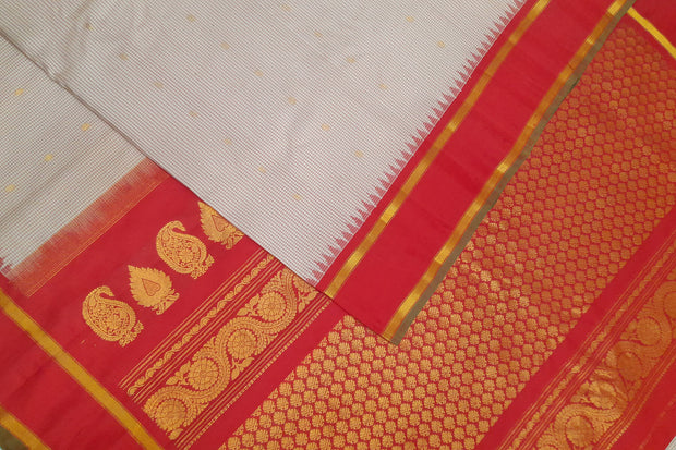 Handwoven Gadwal pure silk saree in off white with fine checks and gold buttis.