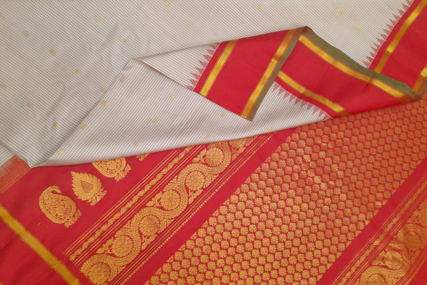 Handwoven Gadwal pure silk saree in off white with fine checks and gold buttis.