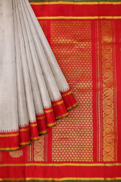 Handwoven Gadwal pure silk saree in off white with fine checks and gold buttis.